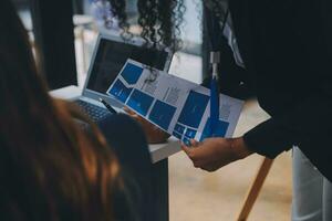 Close up ux developer and ui designer use augmented reality brainstorming about mobile app interface wireframe design on desk at modern office.Creative digital development agency photo