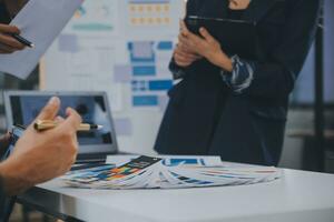 Close up ux developer and ui designer use augmented reality brainstorming about mobile app interface wireframe design on desk at modern office.Creative digital development agency photo