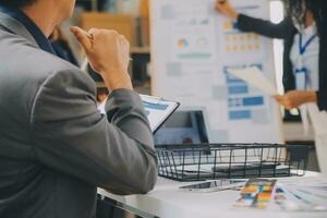 Close up ux developer and ui designer use augmented reality brainstorming about mobile app interface wireframe design on desk at modern office.Creative digital development agency photo