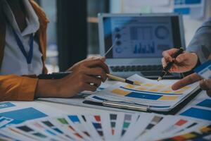 Close up ux developer and ui designer use augmented reality brainstorming about mobile app interface wireframe design on desk at modern office.Creative digital development agency photo