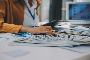 Close up ux developer and ui designer use augmented reality brainstorming about mobile app interface wireframe design on desk at modern office.Creative digital development agency photo