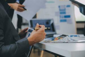 Close up ux developer and ui designer use augmented reality brainstorming about mobile app interface wireframe design on desk at modern office.Creative digital development agency photo