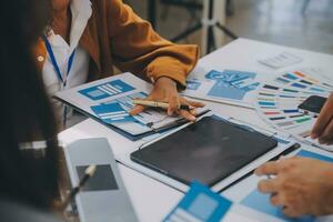 Close up ux developer and ui designer use augmented reality brainstorming about mobile app interface wireframe design on desk at modern office.Creative digital development agency photo