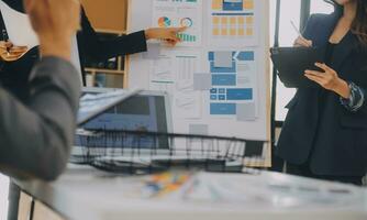 Close up ux developer and ui designer use augmented reality brainstorming about mobile app interface wireframe design on desk at modern office.Creative digital development agency photo