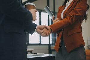 Business handshake for teamwork of business merger and acquisition,successful negotiate,hand shake,two businessman shake hand with partner to celebration partnership and business deal concept photo