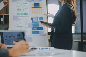 Close up ux developer and ui designer use augmented reality brainstorming about mobile app interface wireframe design on desk at modern office.Creative digital development agency photo