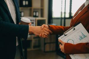 Business handshake for teamwork of business merger and acquisition,successful negotiate,hand shake,two businessman shake hand with partner to celebration partnership and business deal concept photo