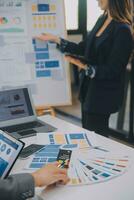 Close up ux developer and ui designer use augmented reality brainstorming about mobile app interface wireframe design on desk at modern office.Creative digital development agency photo