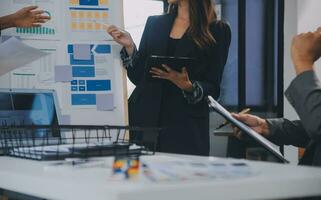 Close up ux developer and ui designer use augmented reality brainstorming about mobile app interface wireframe design on desk at modern office.Creative digital development agency photo