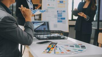 Close up ux developer and ui designer use augmented reality brainstorming about mobile app interface wireframe design on desk at modern office.Creative digital development agency photo