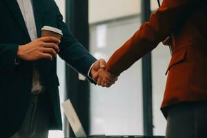 Business handshake for teamwork of business merger and acquisition,successful negotiate,hand shake,two businessman shake hand with partner to celebration partnership and business deal concept photo