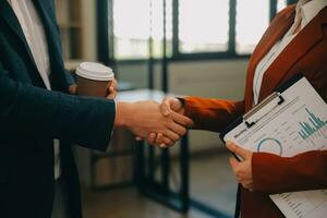 Business handshake for teamwork of business merger and acquisition,successful negotiate,hand shake,two businessman shake hand with partner to celebration partnership and business deal concept photo