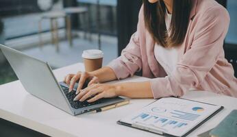 Finance manager meeting discussing company growth project success financial statistics, professional investor working start up project for strategy plan with document, laptop and digital tablet. photo