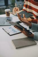 Finance manager meeting discussing company growth project success financial statistics, professional investor working start up project for strategy plan with document, laptop and digital tablet. photo