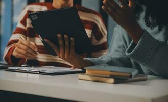 Finance manager meeting discussing company growth project success financial statistics, professional investor working start up project for strategy plan with document, laptop and digital tablet. photo