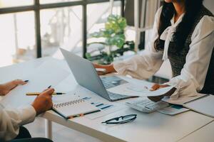 Business team collaboration discussing working analyzing with financial data and marketing growth report graph in team, presentation and brainstorming to strategy planning making profit of company. photo