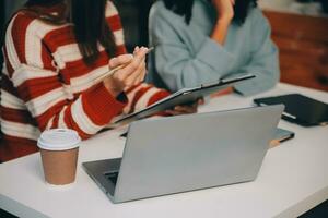 Finance manager meeting discussing company growth project success financial statistics, professional investor working start up project for strategy plan with document, laptop and digital tablet. photo