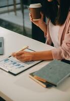 Finance manager meeting discussing company growth project success financial statistics, professional investor working start up project for strategy plan with document, laptop and digital tablet. photo