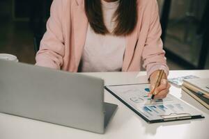 Finance manager meeting discussing company growth project success financial statistics, professional investor working start up project for strategy plan with document, laptop and digital tablet. photo