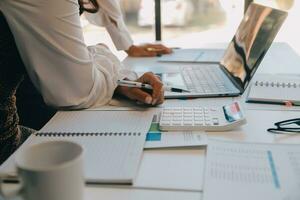 Business team collaboration discussing working analyzing with financial data and marketing growth report graph in team, presentation and brainstorming to strategy planning making profit of company. photo