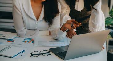Business team collaboration discussing working analyzing with financial data and marketing growth report graph in team, presentation and brainstorming to strategy planning making profit of company. photo