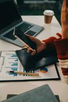 Finance manager meeting discussing company growth project success financial statistics, professional investor working start up project for strategy plan with document, laptop and digital tablet. photo