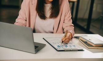 Finance manager meeting discussing company growth project success financial statistics, professional investor working start up project for strategy plan with document, laptop and digital tablet. photo