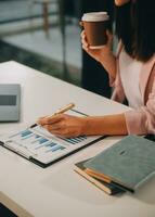 Finance manager meeting discussing company growth project success financial statistics, professional investor working start up project for strategy plan with document, laptop and digital tablet. photo