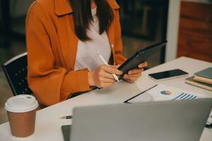Finance manager meeting discussing company growth project success financial statistics, professional investor working start up project for strategy plan with document, laptop and digital tablet. photo