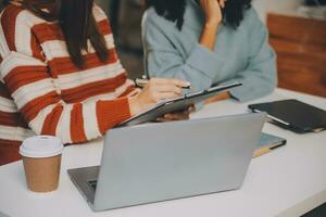 Finance manager meeting discussing company growth project success financial statistics, professional investor working start up project for strategy plan with document, laptop and digital tablet. photo