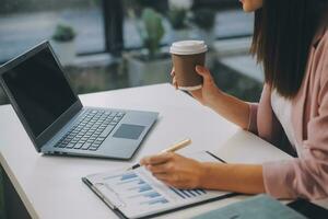 Finance manager meeting discussing company growth project success financial statistics, professional investor working start up project for strategy plan with document, laptop and digital tablet. photo