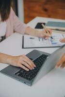 Finance manager meeting discussing company growth project success financial statistics, professional investor working start up project for strategy plan with document, laptop and digital tablet. photo
