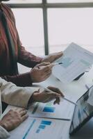Audit concept,Administrator business man financial inspector and secretary making report calculating balance. Internal Revenue Service checking document. photo