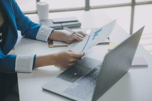Audit concept,Administrator business man financial inspector and secretary making report calculating balance. Internal Revenue Service checking document. photo