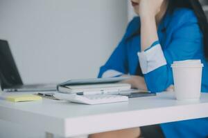 Audit concept,Administrator business man financial inspector and secretary making report calculating balance. Internal Revenue Service checking document. photo