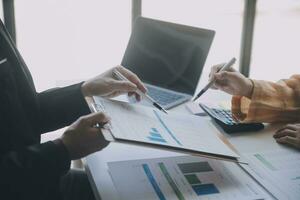 Audit concept,Administrator business man financial inspector and secretary making report calculating balance. Internal Revenue Service checking document. photo