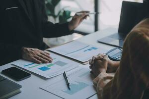 Audit concept,Administrator business man financial inspector and secretary making report calculating balance. Internal Revenue Service checking document. photo