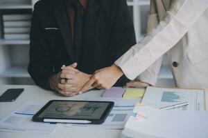 Audit concept,Administrator business man financial inspector and secretary making report calculating balance. Internal Revenue Service checking document. photo