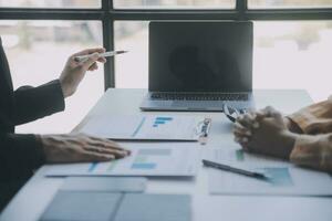 Audit concept,Administrator business man financial inspector and secretary making report calculating balance. Internal Revenue Service checking document. photo