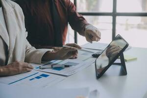 Audit concept,Administrator business man financial inspector and secretary making report calculating balance. Internal Revenue Service checking document. photo