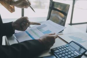 Audit concept,Administrator business man financial inspector and secretary making report calculating balance. Internal Revenue Service checking document. photo