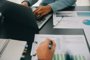 Financial Business team present. Business man hands hold documents with financial statistic stock photo, discussion, and analysis report data the charts and graphs. Finance Financial concept photo
