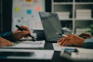 Financial Business team present. Business man hands hold documents with financial statistic stock photo, discussion, and analysis report data the charts and graphs. Finance Financial concept photo