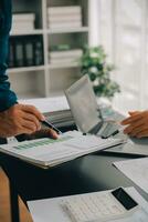 Financial Business team present. Business man hands hold documents with financial statistic stock photo, discussion, and analysis report data the charts and graphs. Finance Financial concept photo