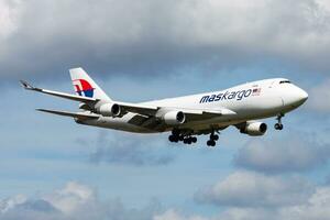 Amsterdam, Netherlands, 2014 - Malaysia Airlines MASkargo Boeing 747-400 9M-MPR cargo plane arrival and landing at Amsterdam Schipol Airport photo