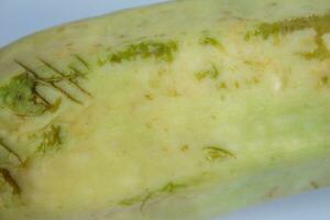 A zucchini that started to rot, closeup photo