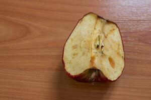 Moldy or rotten apple, closeup photo