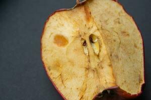 Moldy or rotten apple, closeup photo