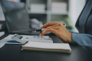 Financial Business team present. Business man hands hold documents with financial statistic stock photo, discussion, and analysis report data the charts and graphs. Finance Financial concept photo