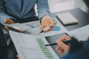 Financial Business team present. Business man hands hold documents with financial statistic stock photo, discussion, and analysis report data the charts and graphs. Finance Financial concept photo